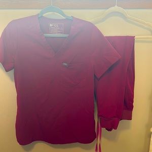 Figs scrubs dark magenta top is a size small bottom is a size medium